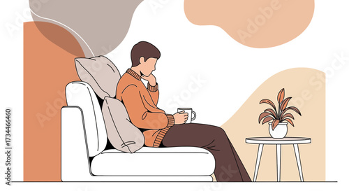 Man relaxing on sofa with coffee enjoying the moment of peace and quiet time
