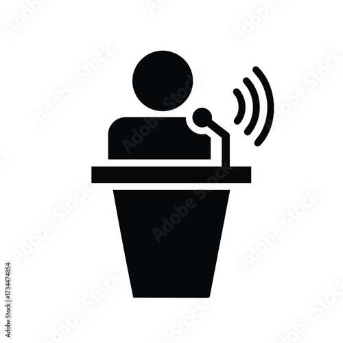 Person Standing at a Podium Giving a Speech or Presentation with a Microphone in a Formal Setting