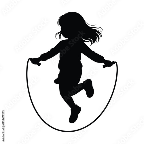 Silhouette of a young girl joyfully jumping rope outdoors