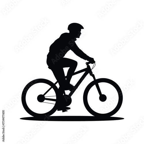 Silhouette of a mountain biker riding a bicycle