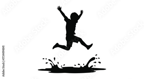 Joyful leaping figure with water splashes presented as a striking silhouette