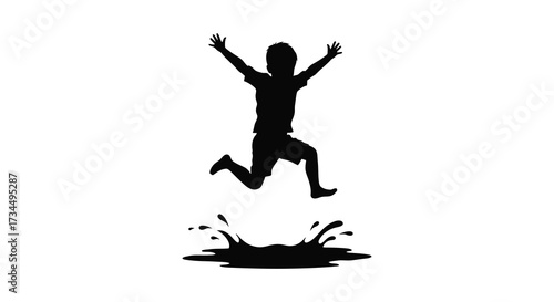 Joyful child leaping in the air above a water splash silhouette