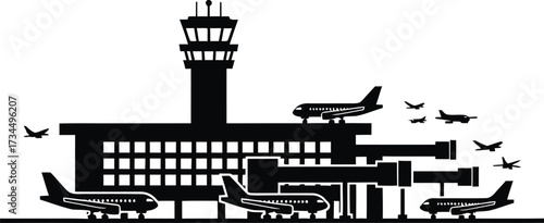 Silhouette of a busy airport terminal with planes and control tower