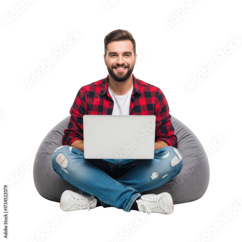 Wallpaper Mural A smiling man with a beard wearing a red plaid shirt and jeans sits cross legged on a beanbag chair with a laptop isolated on transparent background Torontodigital.ca