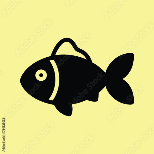 Simple black silhouette of a fish with a hook in its mouth on a pale yellow
