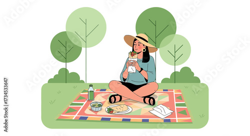 Young woman enjoying a picnic with a delicious wrap in a serene park setting outdoors