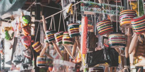 Colorful traditional Mexican toys and crafts hanging in a market stall, showcasing vibrant local culture and handmade artistry.
