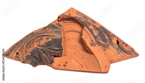 Ancient ceramic fragment with dark patterns. Broken pottery
