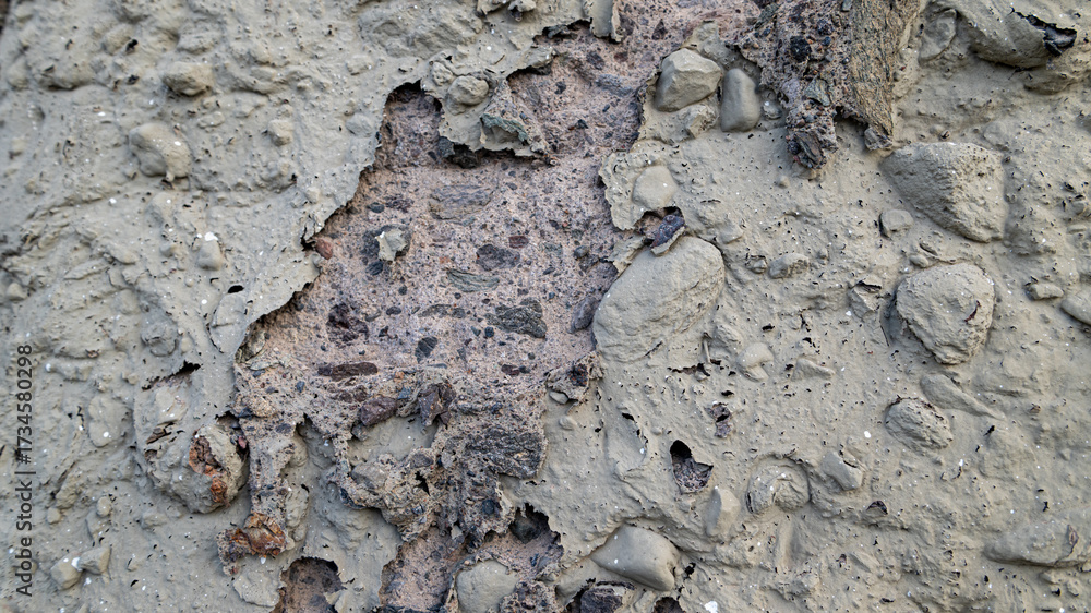 Obraz premium Damaged concrete wall texture with stones
