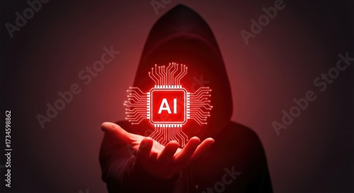 Hooded figure holding glowing red A I chip circuit board AI artificial intelligence technology