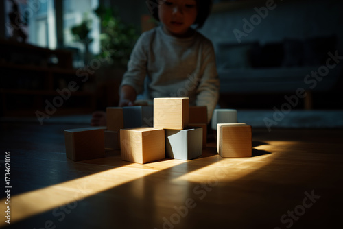Child Playing with Wooden Building Blocks