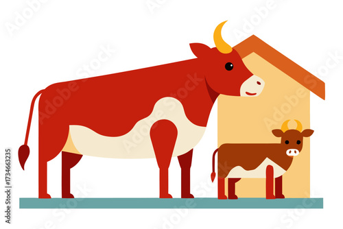 A domestic cow with calf in a barn