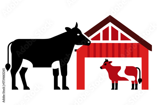 A domestic cow with calf in a barn