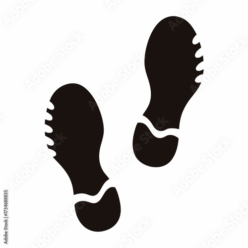 Black footprints illustration on white backdrop representing progress and movement