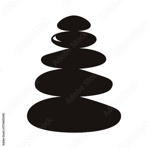 Silhouette of stacked zen stones conveying balance and calm relaxation of nature