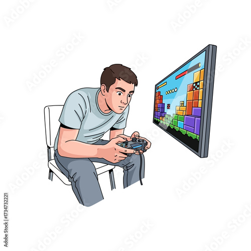A young man sits on a chair, engrossed in playing a colorful block puzzle video game on a large screen with a game controller.