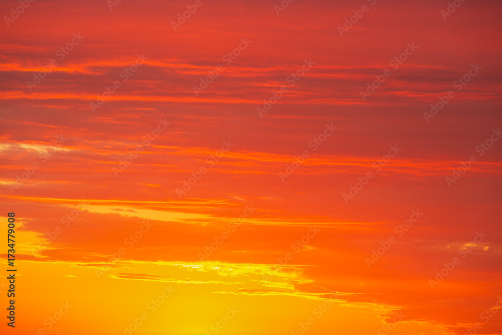 Obraz premium A Vibrant Sunset That Spreads Over a Serene and Calm Horizon, Creating a Picturesque Scene