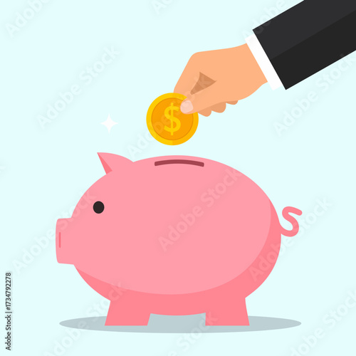 Close-up of a person's hand inserting a coin into a piggy bank, symbolizing saving money and financial planning
