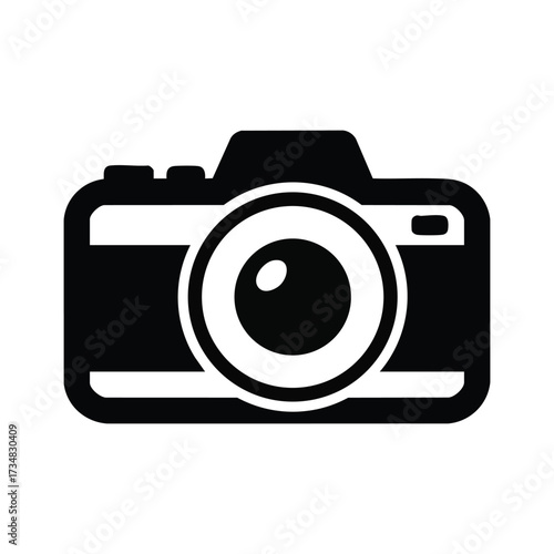 Close-up of a vintage film camera with detailed dials and lens set against a plain