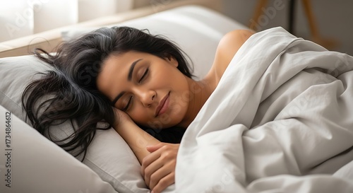 Woman Sleeping peacefully in bed.