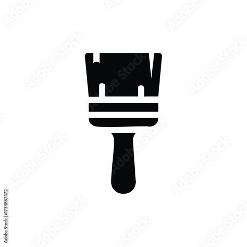 Close-up of a paintbrush with a wooden handle and synthetic bristles, used for artistic painting and decorating surfaces