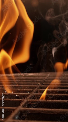 Panning down shot of a empty charcoal grill is being heated for barbecuing beef steak