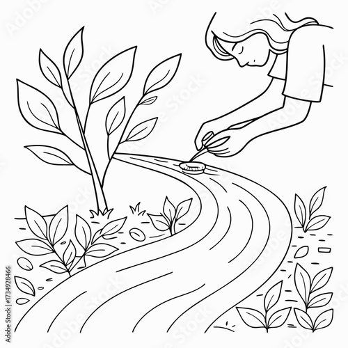 A person carefully places a small round object into a winding stream surrounded by lush green plants and a young sapling symbolizing nature s delicate balance and gentle care