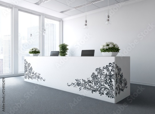 A modern office reception desk, adorned with intricate black floral patterns, stands against a bright white backdrop.
