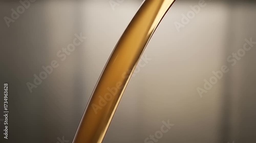 Golden Viscous Liquid Pouring in Slow Motion.