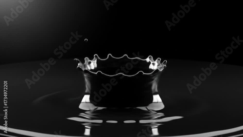 Dramatic Splash Formed By Falling Liquid Droplets In Dark Background High Speed Photography