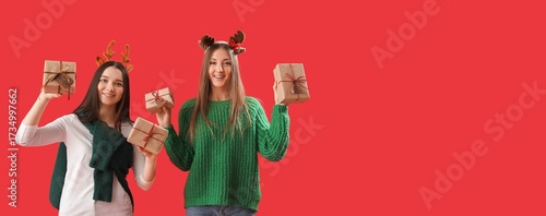 Young women holding Christm...