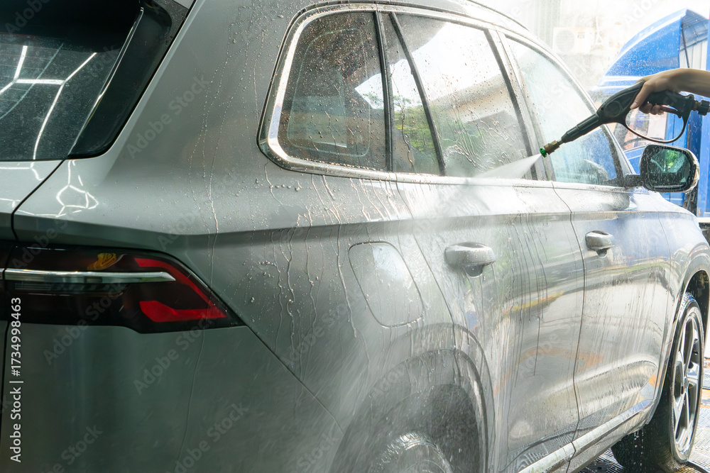 Obraz premium washing a car with water at horizontal composition