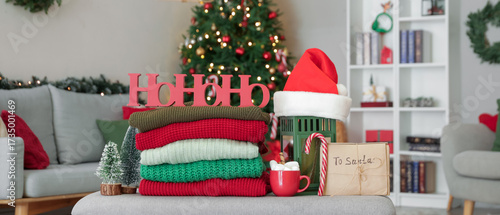 Stack of winter clothes wit...