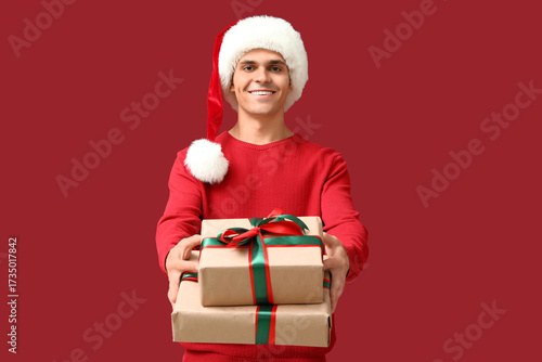 Young man in Santa hat with...