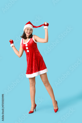 Happy young woman in Santa ...