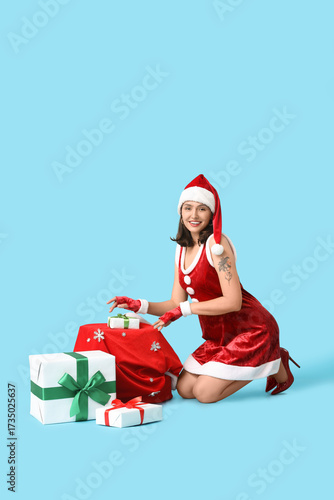 Young woman in Santa Claus ...