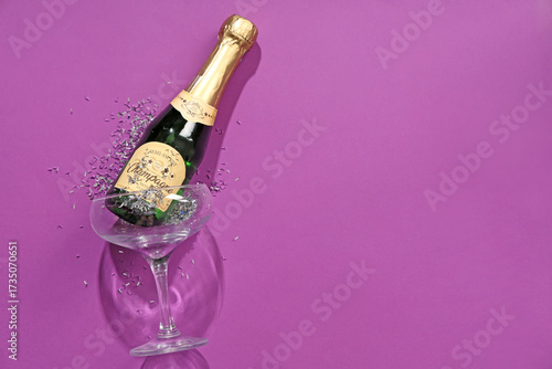 Bottle of champagne with gl...