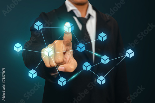 Businessman pressing blockchain cube connections, symbolizing secure digital ledger and crypto system. Best for fintech, data, and innovation concepts.
