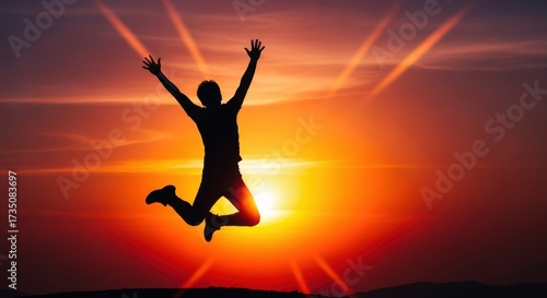 Wallpaper Mural Silhouette of a person joyfully jumping high against a vibrant sunset sky Torontodigital.ca