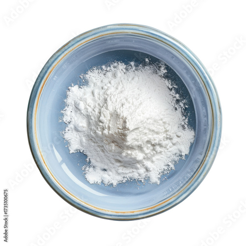 Top-down view of baking powder in a blue ceramic bowl with golden rim isolated on white background