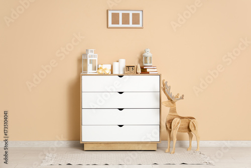Wooden deer, chest of drawe...