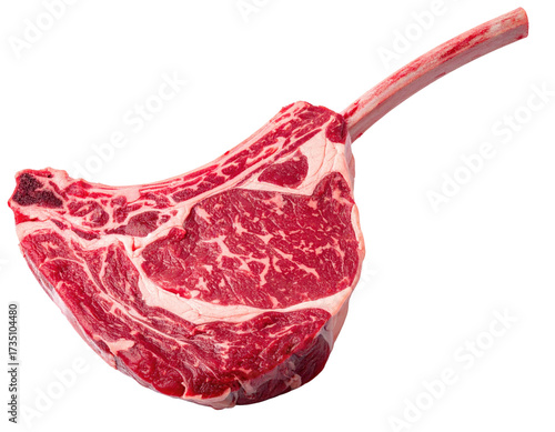 Thick, raw ribeye steak with bone-in handle, isolated on a black background