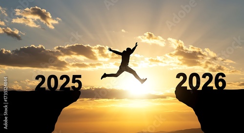 Silhouette of a person jumping from 2025 to 2026 at sunset
