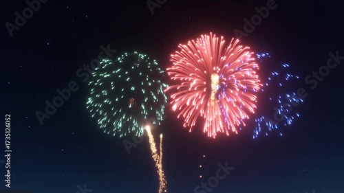 Three colorful fireworks explode in the night sky, creating vibrant bursts of light and celebration.