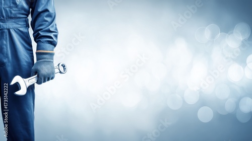 Mechanic with Wrench: A skilled mechanic in work attire, confidently holding a wrench, poised to tackle any mechanical challenge. Represents technical expertise and dedication to precision in service.