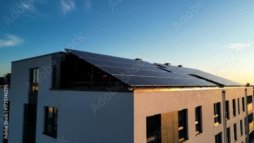 Wallpaper Mural Modern building with solar panel on roof during sunset. Sustainable energy production and ecological urban housing concept. Renewable power footage. Torontodigital.ca