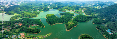 Aerial view of Tuyen Lam lake in Dalat, Vietnam with blue water and paradise islands below give this place a relaxing tourist attraction. This is a hydroelectric lake that provides energy for highland