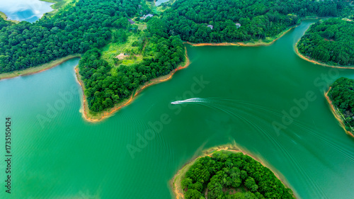 Aerial view of Tuyen Lam lake in Dalat, Vietnam with blue water and paradise islands below give this place a relaxing tourist attraction. This is a hydroelectric lake that provides energy for highland