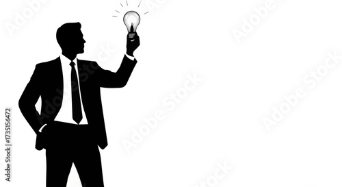 Confident businessman sparks a brilliant new idea, holding a glowing lightbulb symbolizing innovation and creative problem-solving.