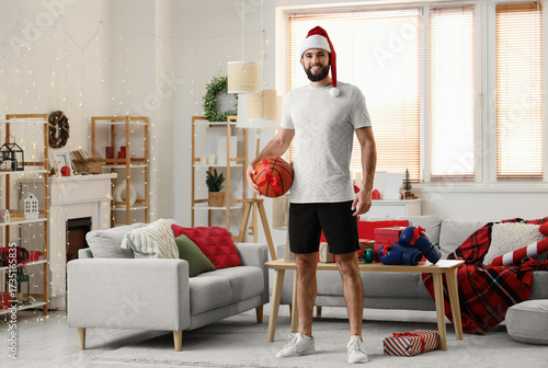 Young happy man in Santa ha...